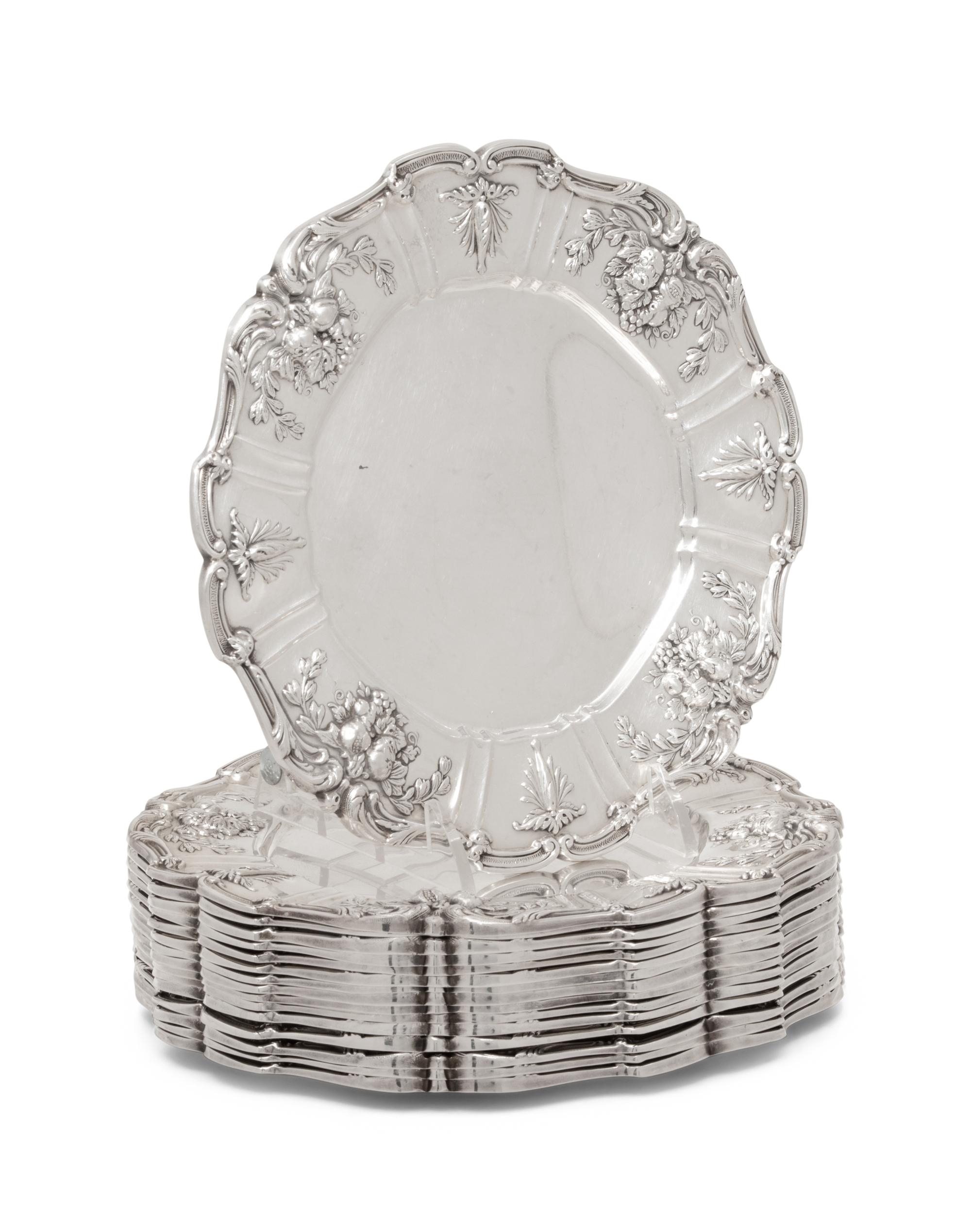 A Set of Sixteen American Silver Bread Plates