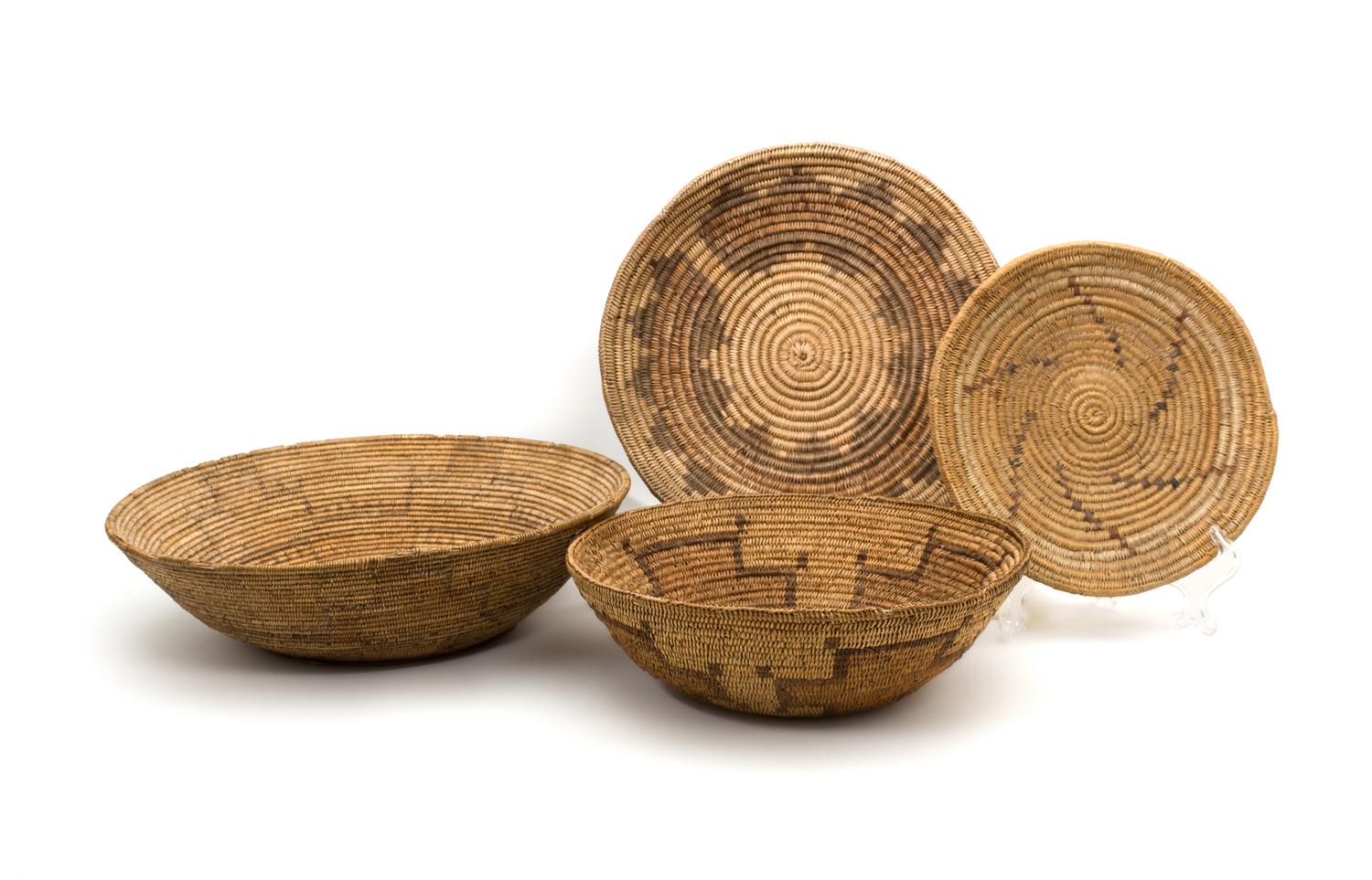 Seven Navajo/ Jicarilla Area Baskets Height of largest 4 x diameter 15 inches.
