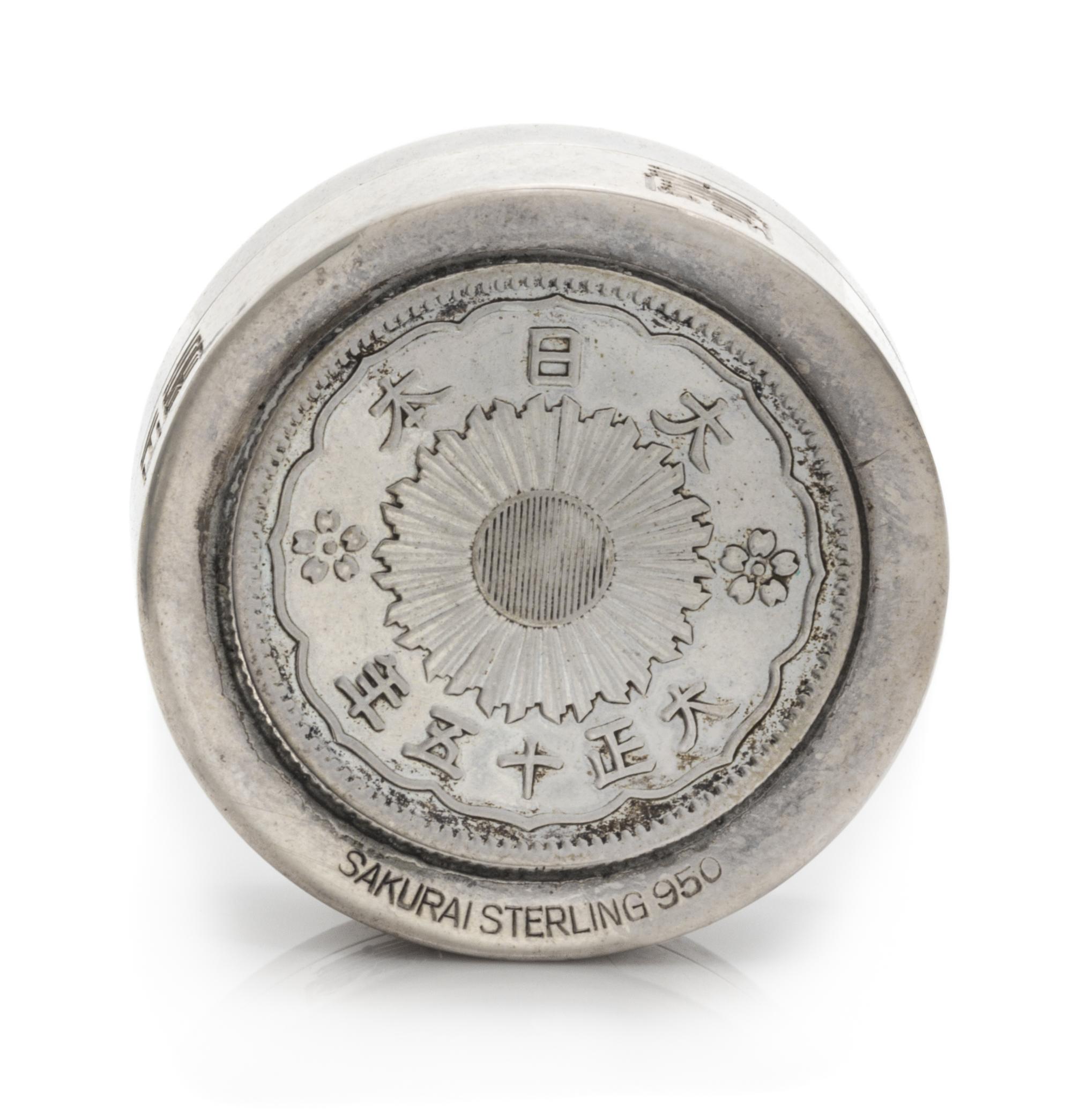 A Japanese Sakurai Silver Snuff Box, Mid-20th Century, the lid and base with inset 20 sen coins.