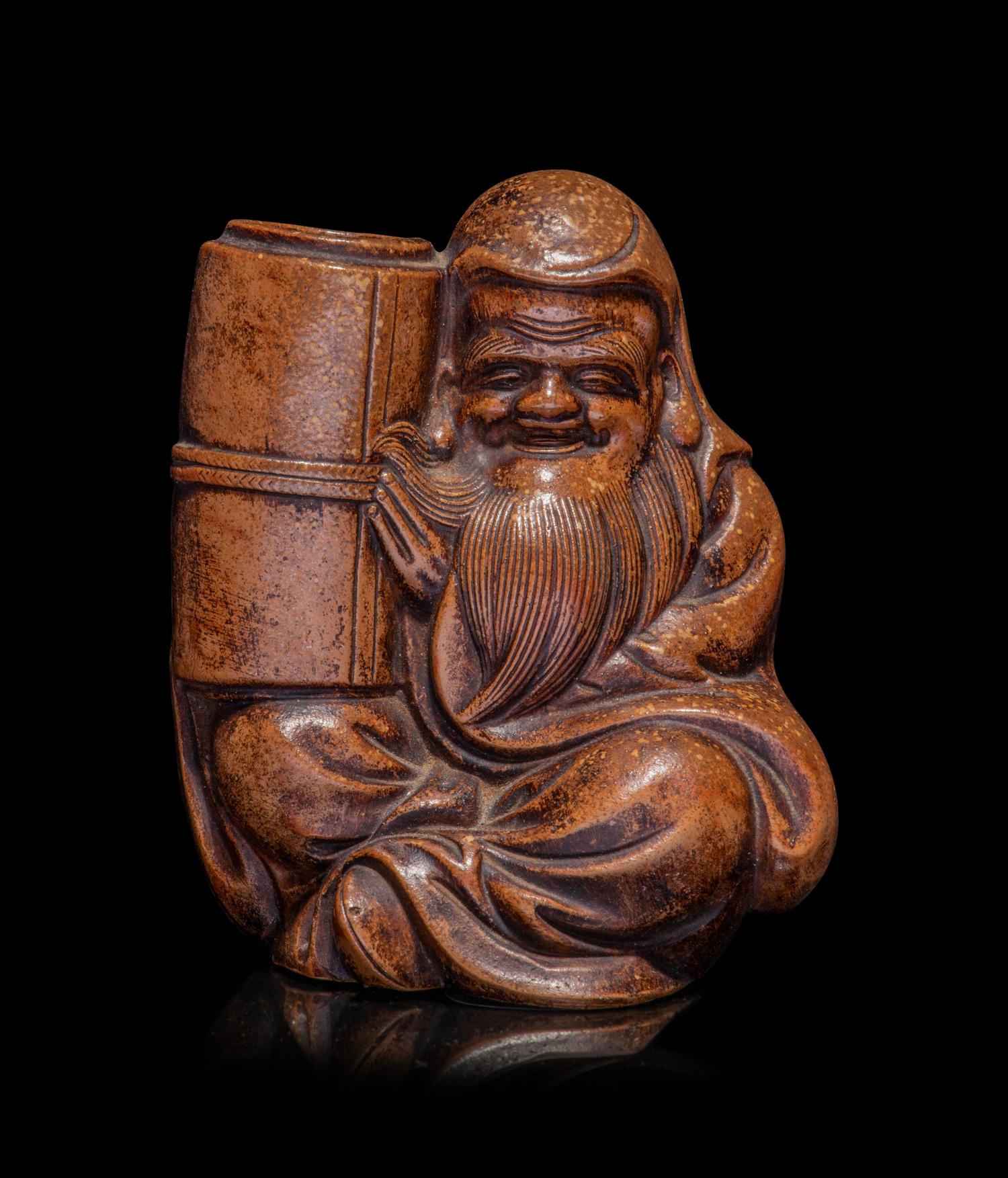 A Japanese Bronze Figure of a Seated Immortal