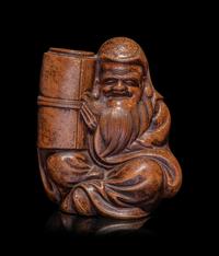 A Japanese Bronze Figure of a Seated Immortal