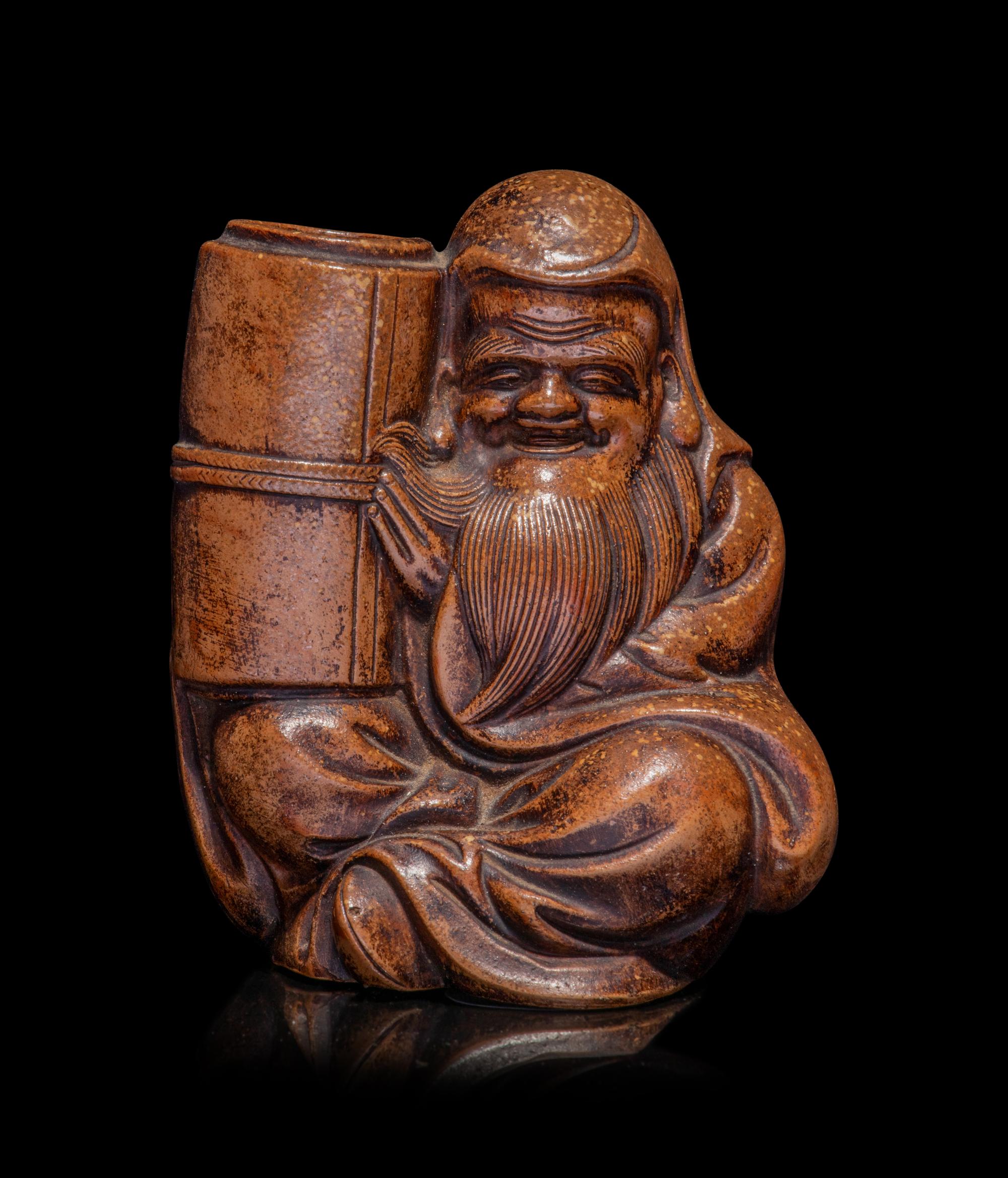 A Japanese Bronze Figure of a Seated Immortal