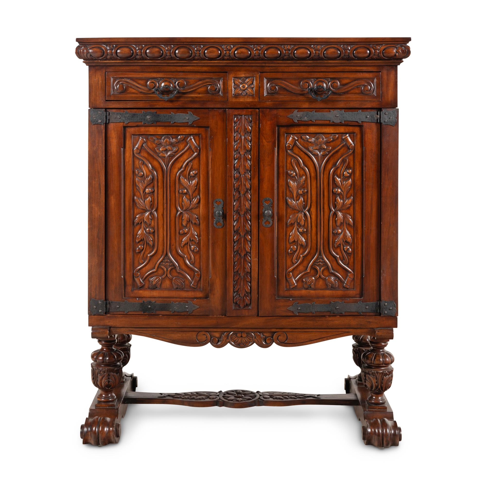 A Baroque Style Carved Walnut and Steel Mounted Cabinet