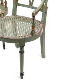 A Set of Four English Painted Armchairs with Cane Seats