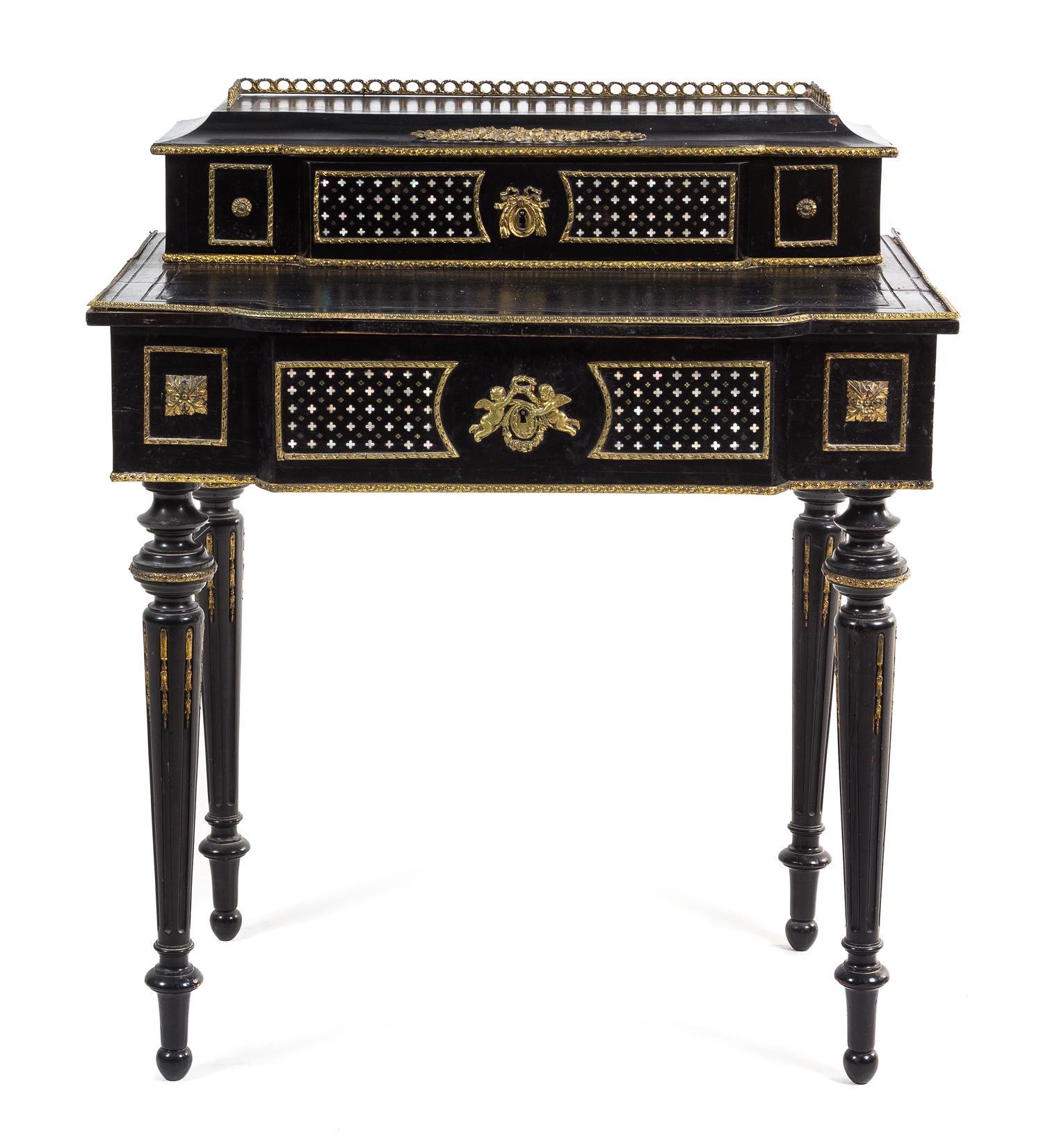A Napoleon III Mother-of-Pearl Inlaid Ebonized Desk Height 36 1/4 x width 30 3/4 x depth 21 inches. — 19TH CENTURY