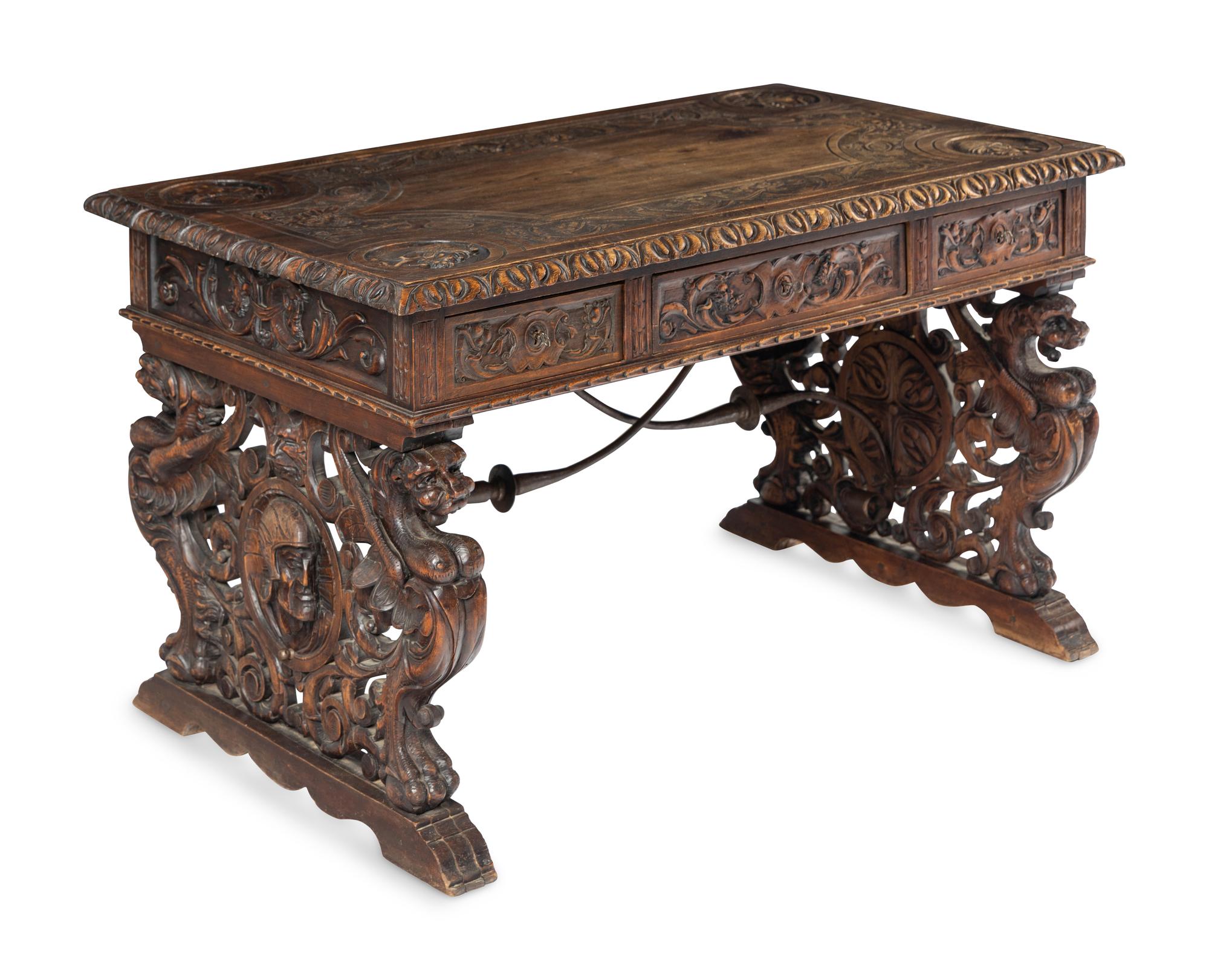 A Renaissance Revival Iron-Mounted Carved Walnut Library Table