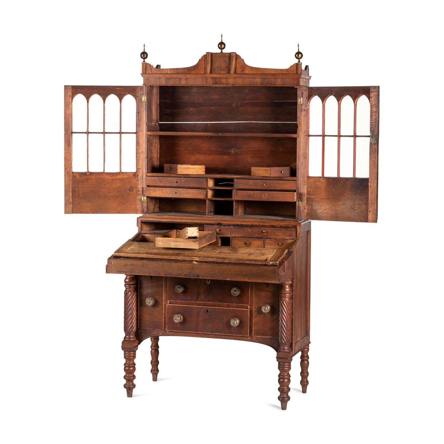 A Classical Figured Maple and Mahogany Desk-and-Bookcase