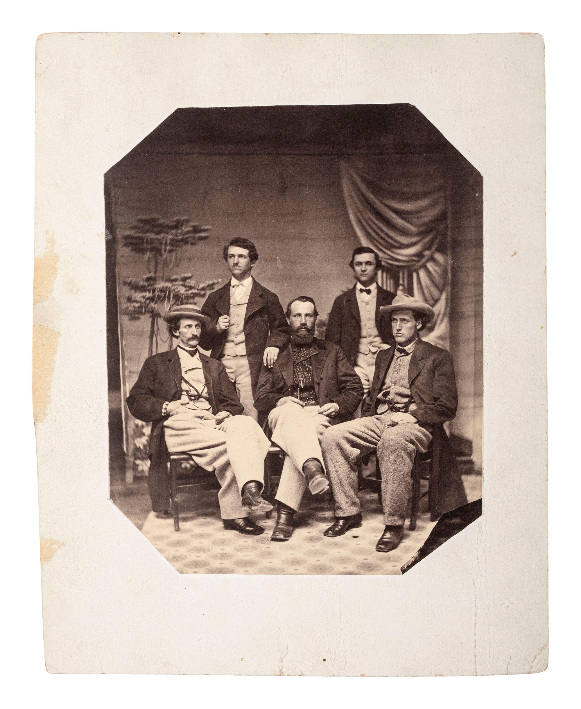 [WESTERN AMERICANA]. Studio photograph showing a group of identified advance scouts working for the Union Pacific Railroad. Ca 1867.
