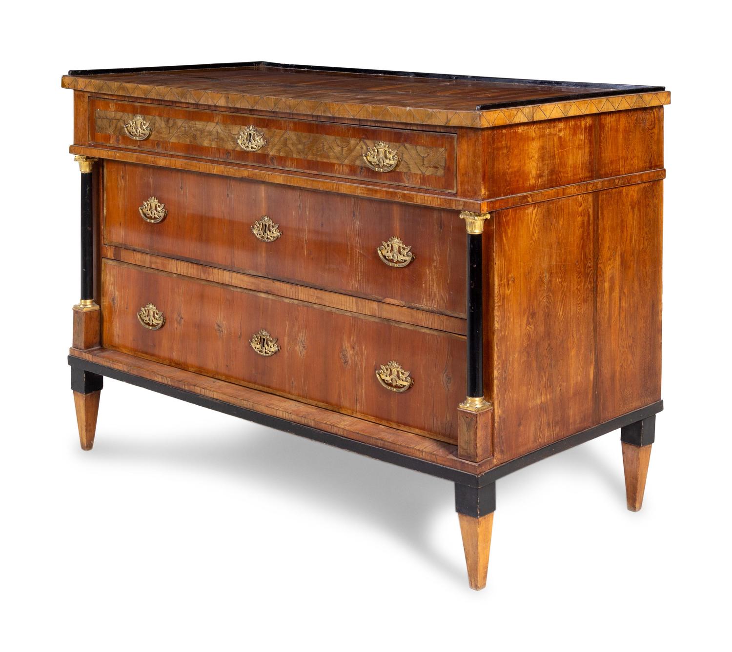 A Continental Inlaid and Parcel Ebonized Commode