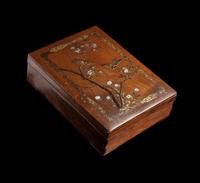 A Japanese Mother-of-Pearl Inlaid Gilt and Black Lacquered Hardwood Stationary Box