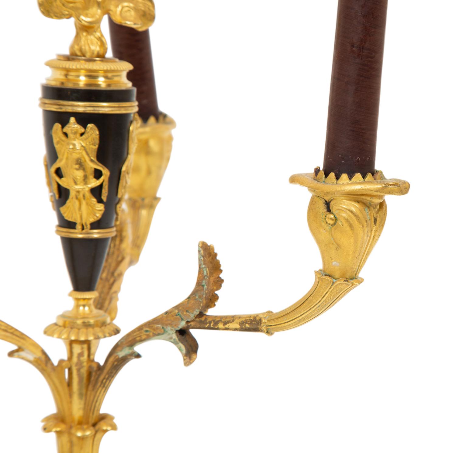 A Pair of Empire Style Gilt and Patinated Bronze Three-Light Candelabra