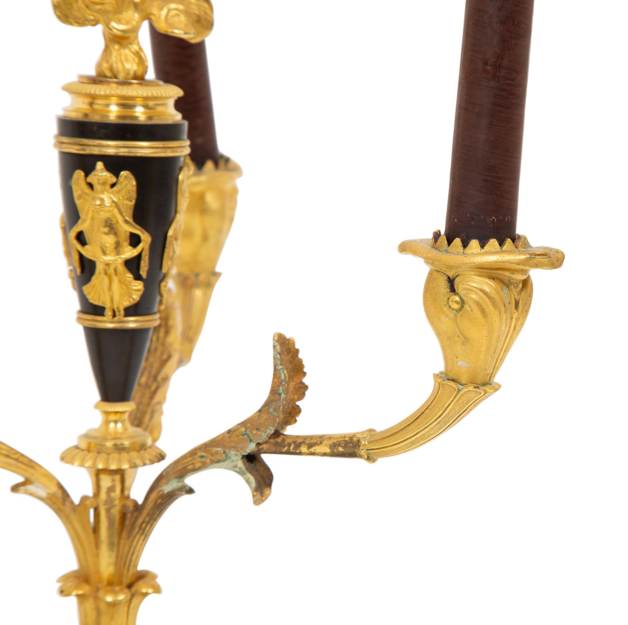 A Pair of Empire Style Gilt and Patinated Bronze Three-Light Candelabra