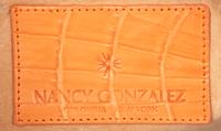 Nancy Gonzalez, Two Orange Handbags