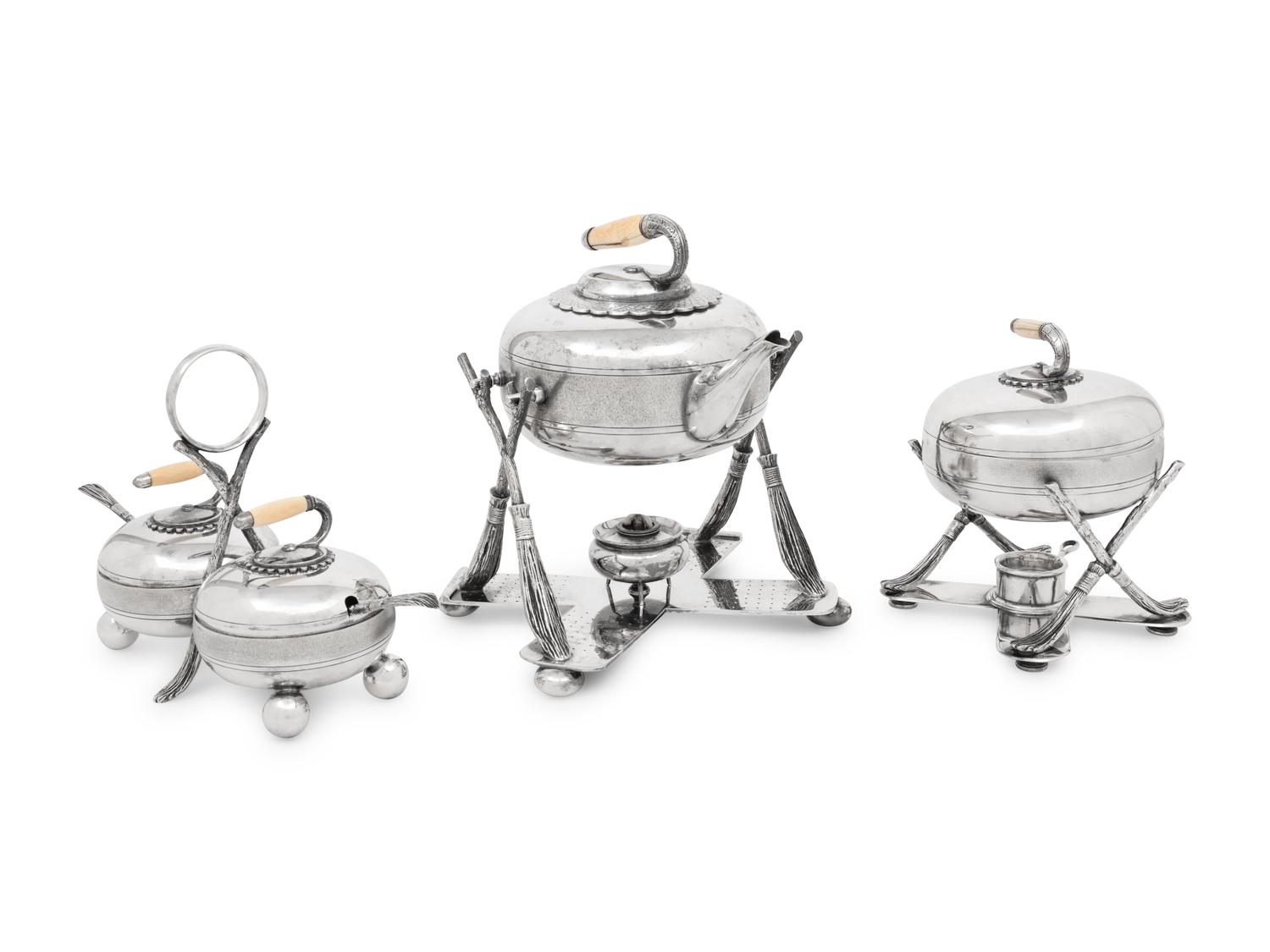 A Group of Three Curling Stone-Form Silver-Plate Table Articles