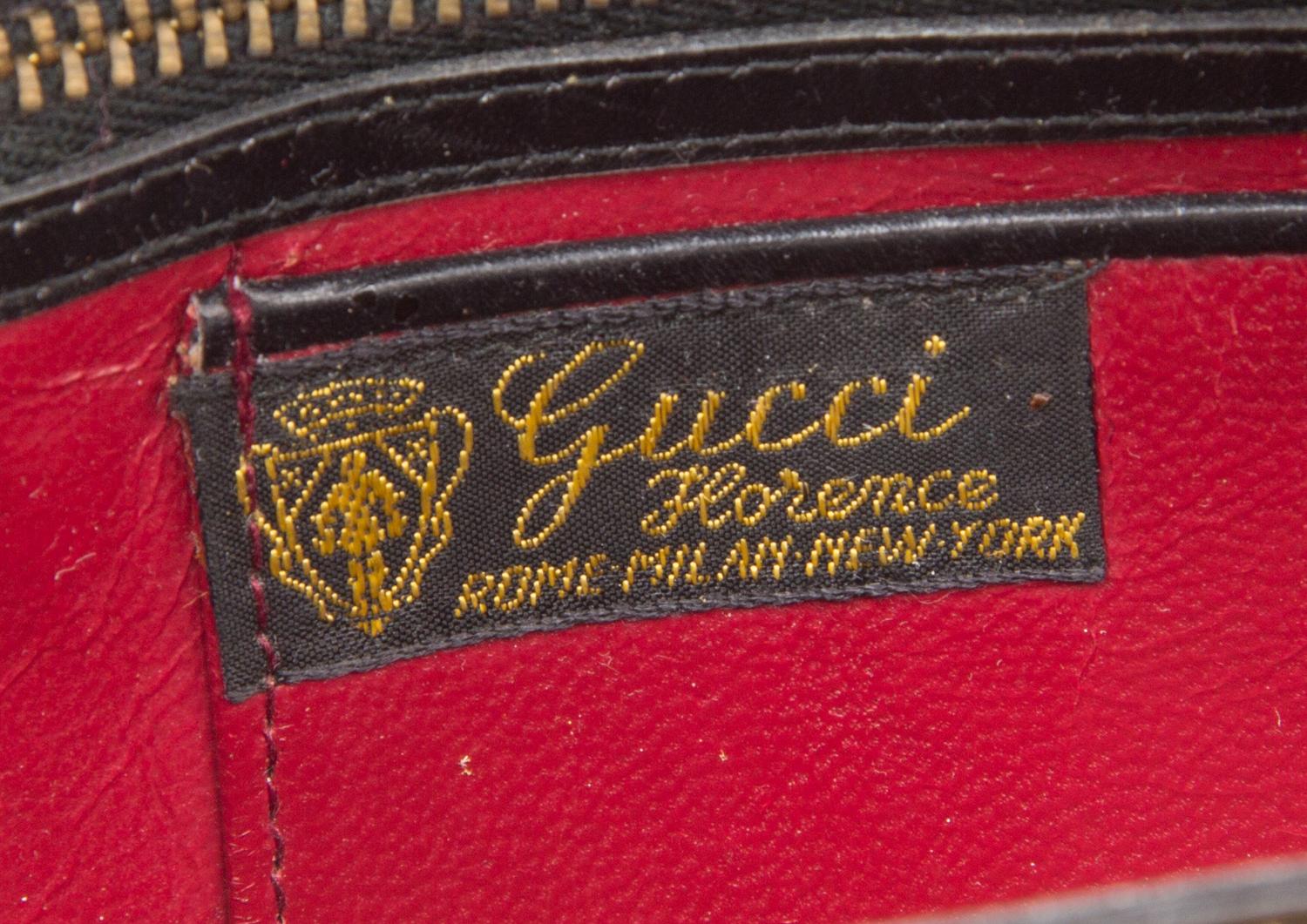 A Gucci Black Leather Handbag, 10.75" x 7.5" x 3".
