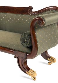 A Classical Carved and Figured Mahogany and Upholstered Sofa