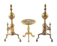 A Pair of Brass Andirons and a Fireplace Trivet