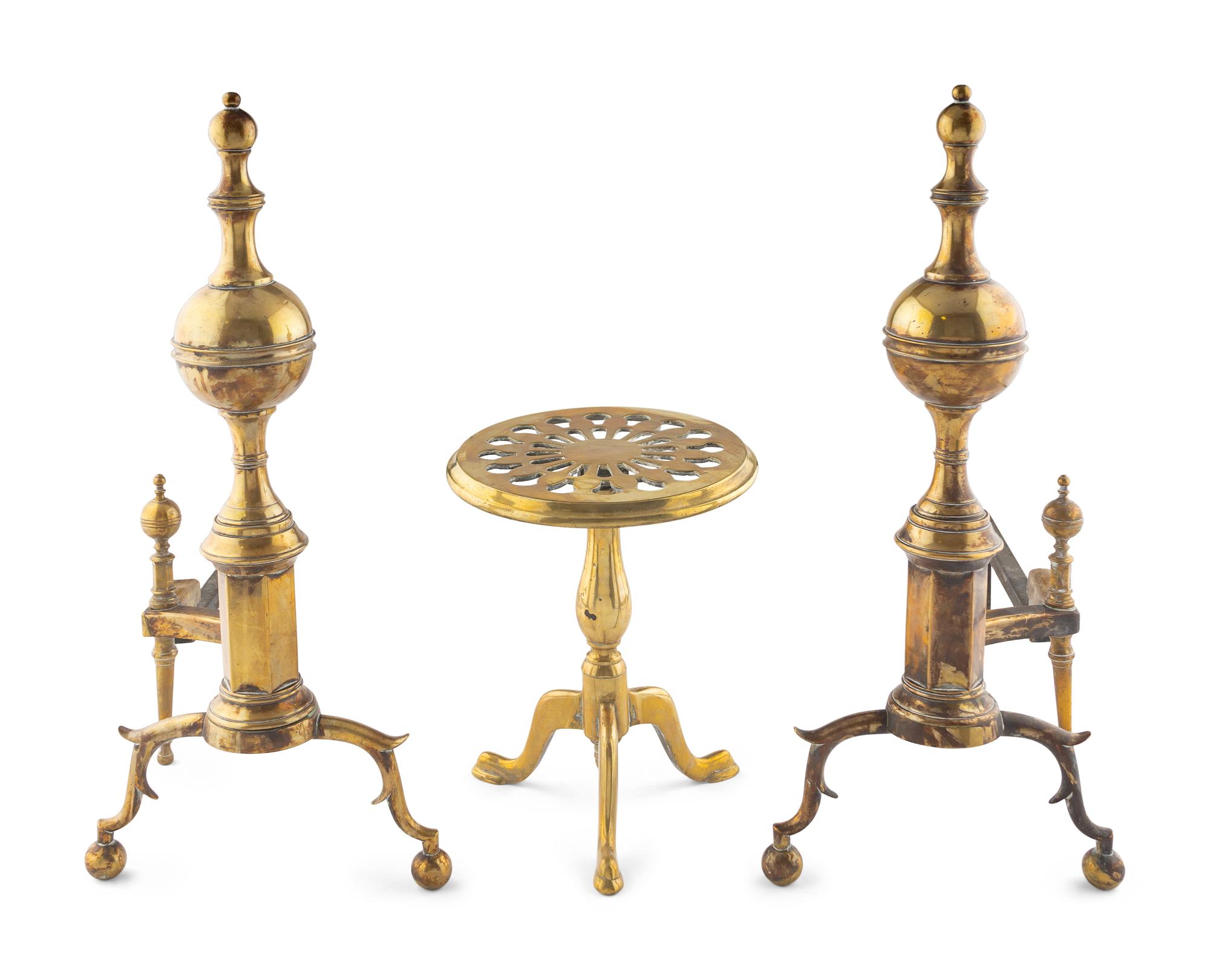 A Pair of Brass Andirons and a Fireplace Trivet