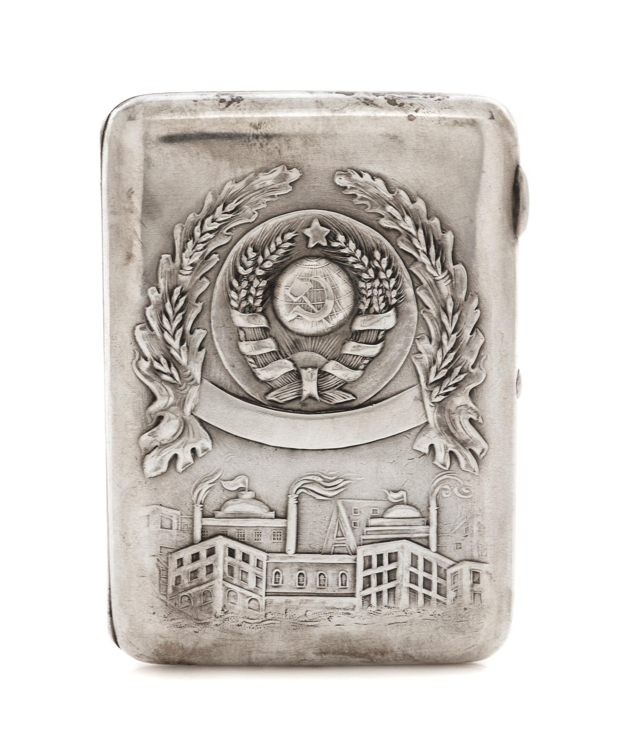 A Russian Silver Cigarette Case, Retailed by Mostorg, Moscow, 20th century, the lid worked with the seal of the Soviet Union above an i