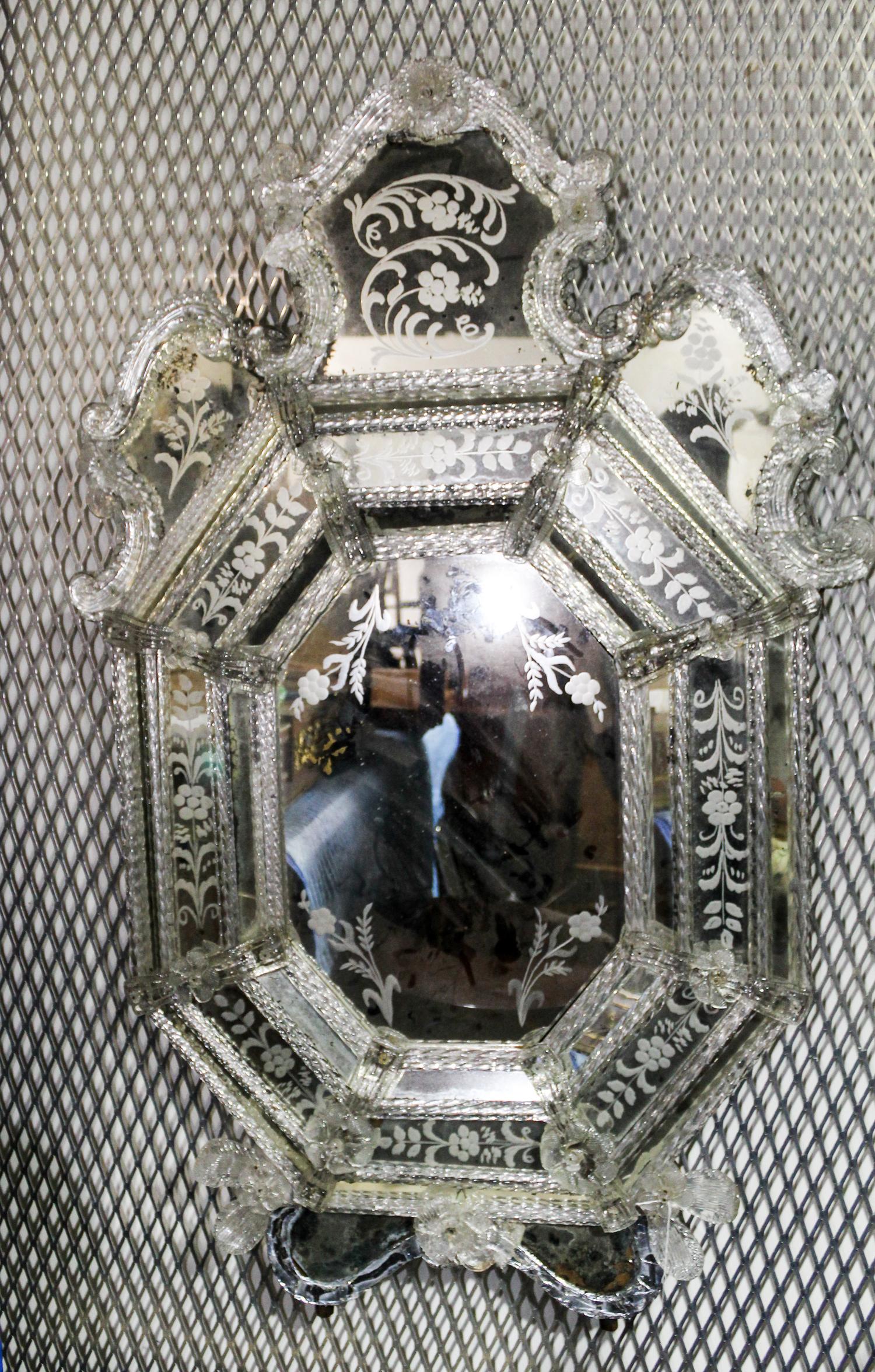 A Venetian Mirror. Length overall 45 inches.
