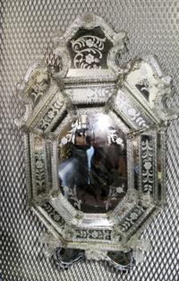 A Venetian Mirror. Length overall 45 inches.