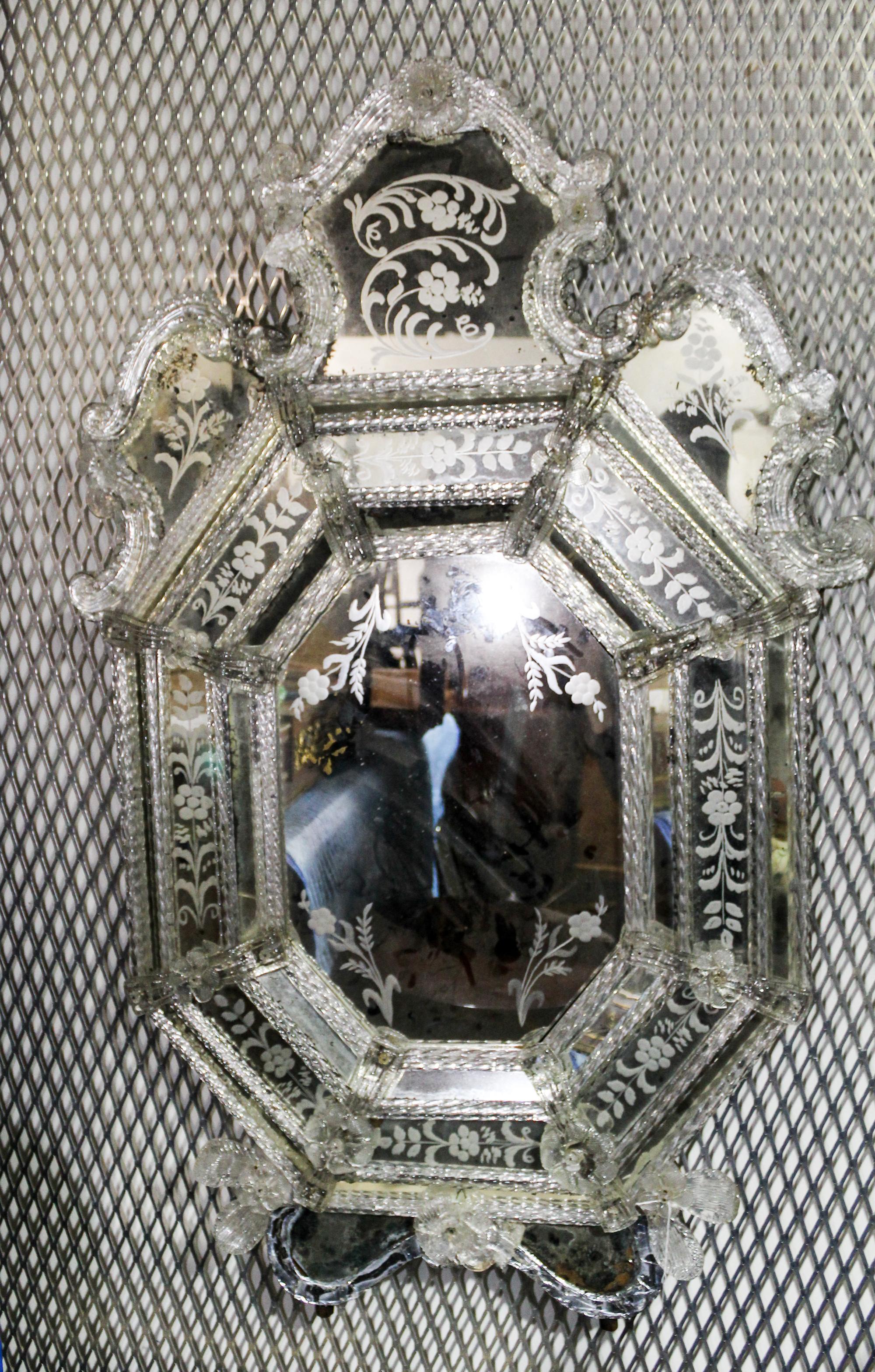 A Venetian Mirror. Length overall 45 inches.