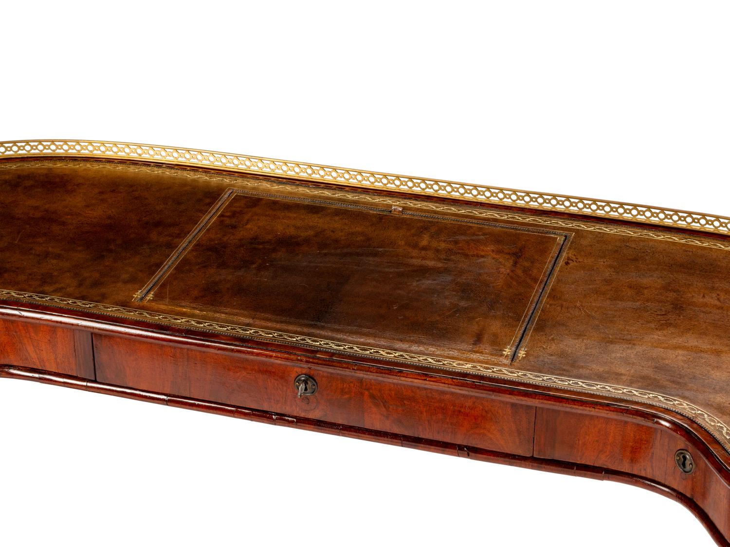 An English Brass-Mounted Mahogany Kidney-Shaped Reading Table — 19TH CENTURY