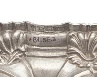 An Assembled Set Of Four George III Sterling Silver Candlesticks
