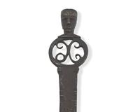 A Copper-Inlaid Wrought Iron Slotted Spoon with Human Head-Form Terminals