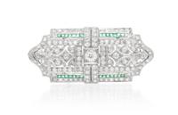 An Art Deco Platinum, Diamond and Emerald Brooch, 7.70 dwts.