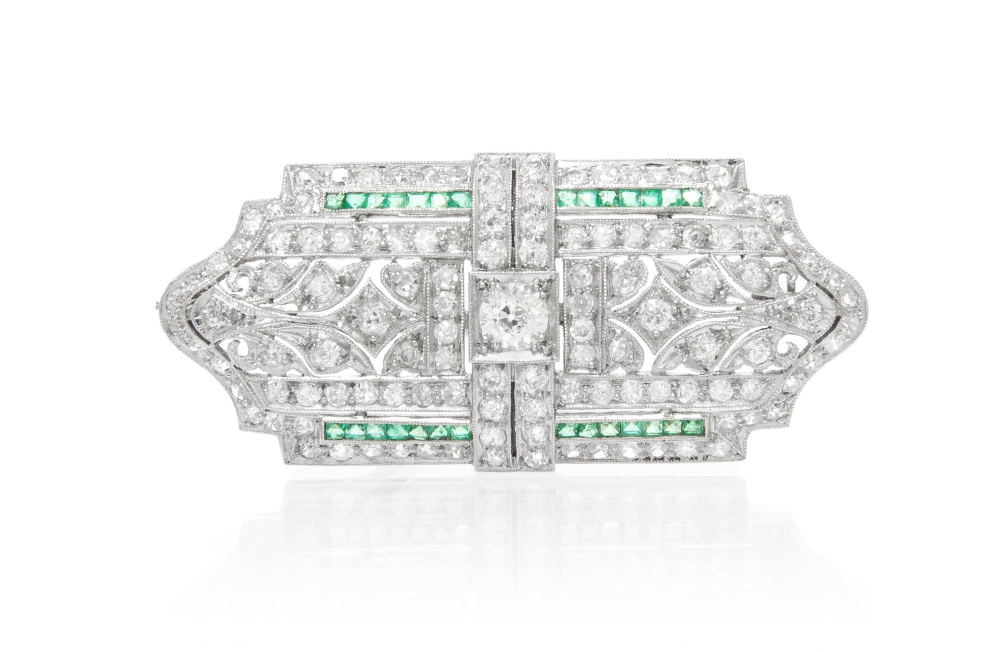 An Art Deco Platinum, Diamond and Emerald Brooch, 7.70 dwts.
