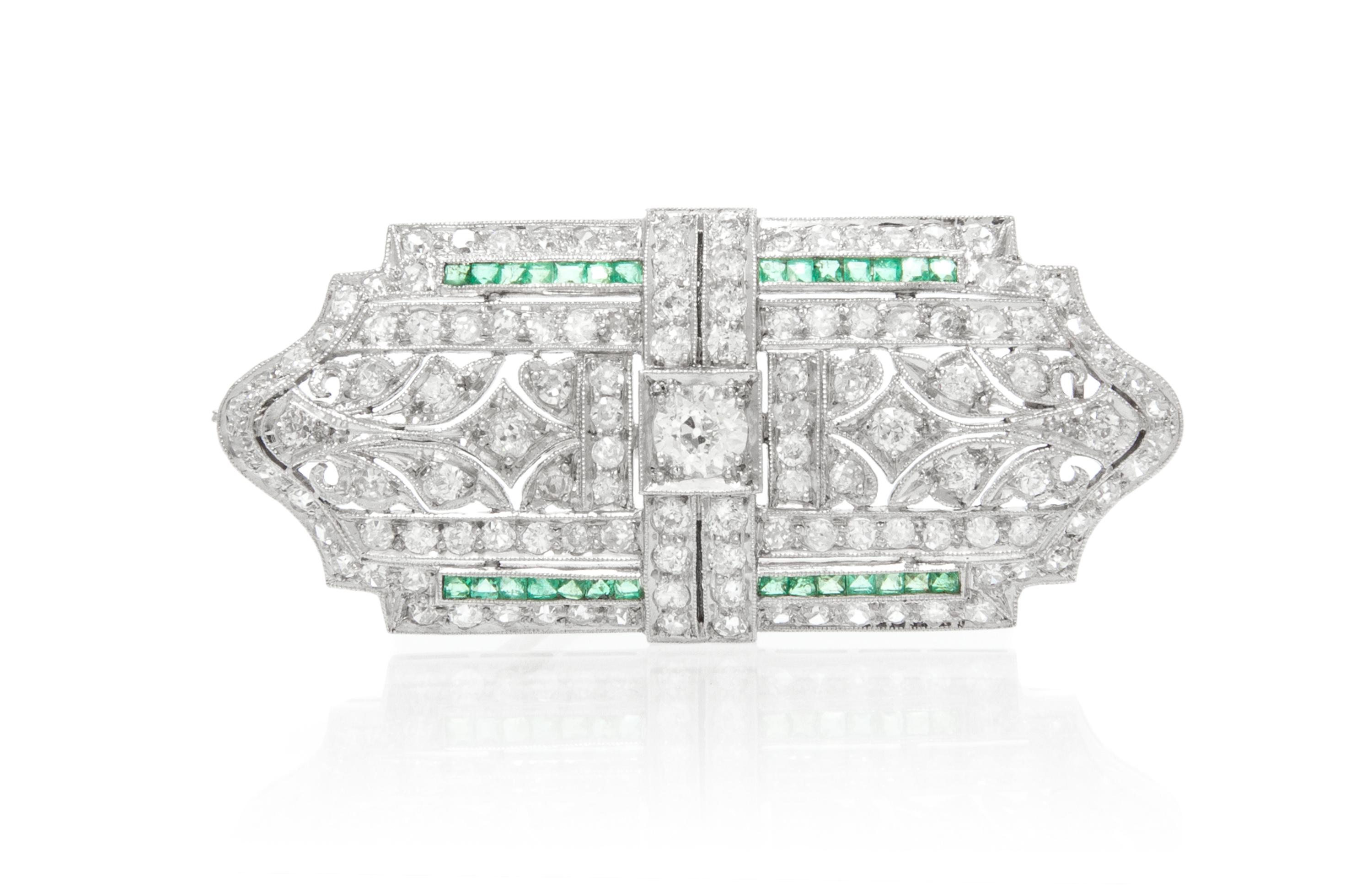 An Art Deco Platinum, Diamond and Emerald Brooch, 7.70 dwts.