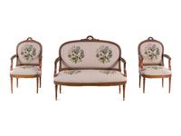 A Louis XVI Carved Walnut Seating Suite with Petit Point Upholstery