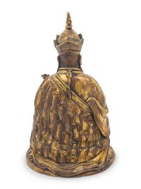A Tibetan Gilt Bronze Figure of a Seated Guru