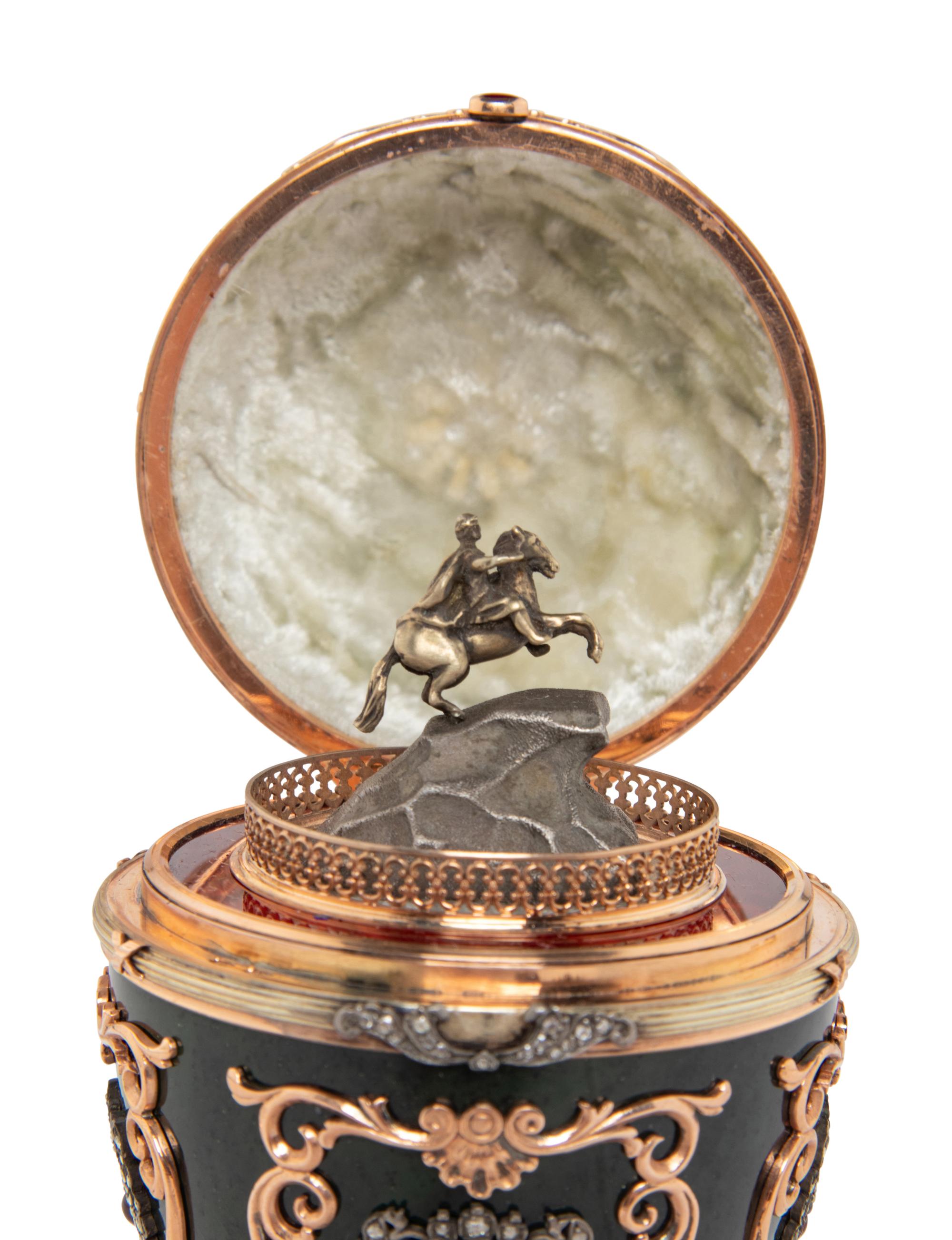 A Gold, Enamel and Gemstone-Mounted Nephrite Surprise Egg