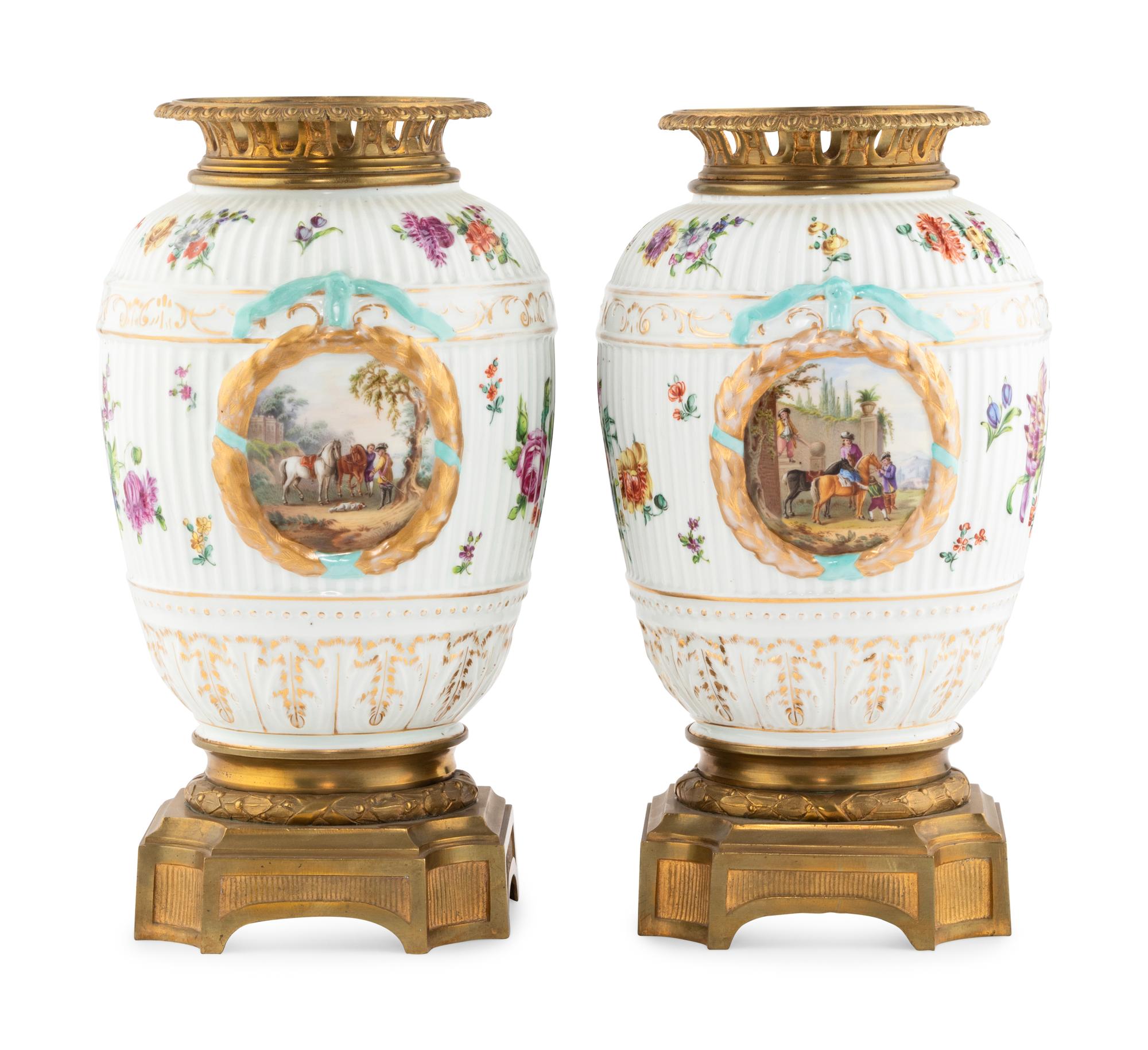 A Pair of German Gilt Bronze Mounted Porcelain Urns