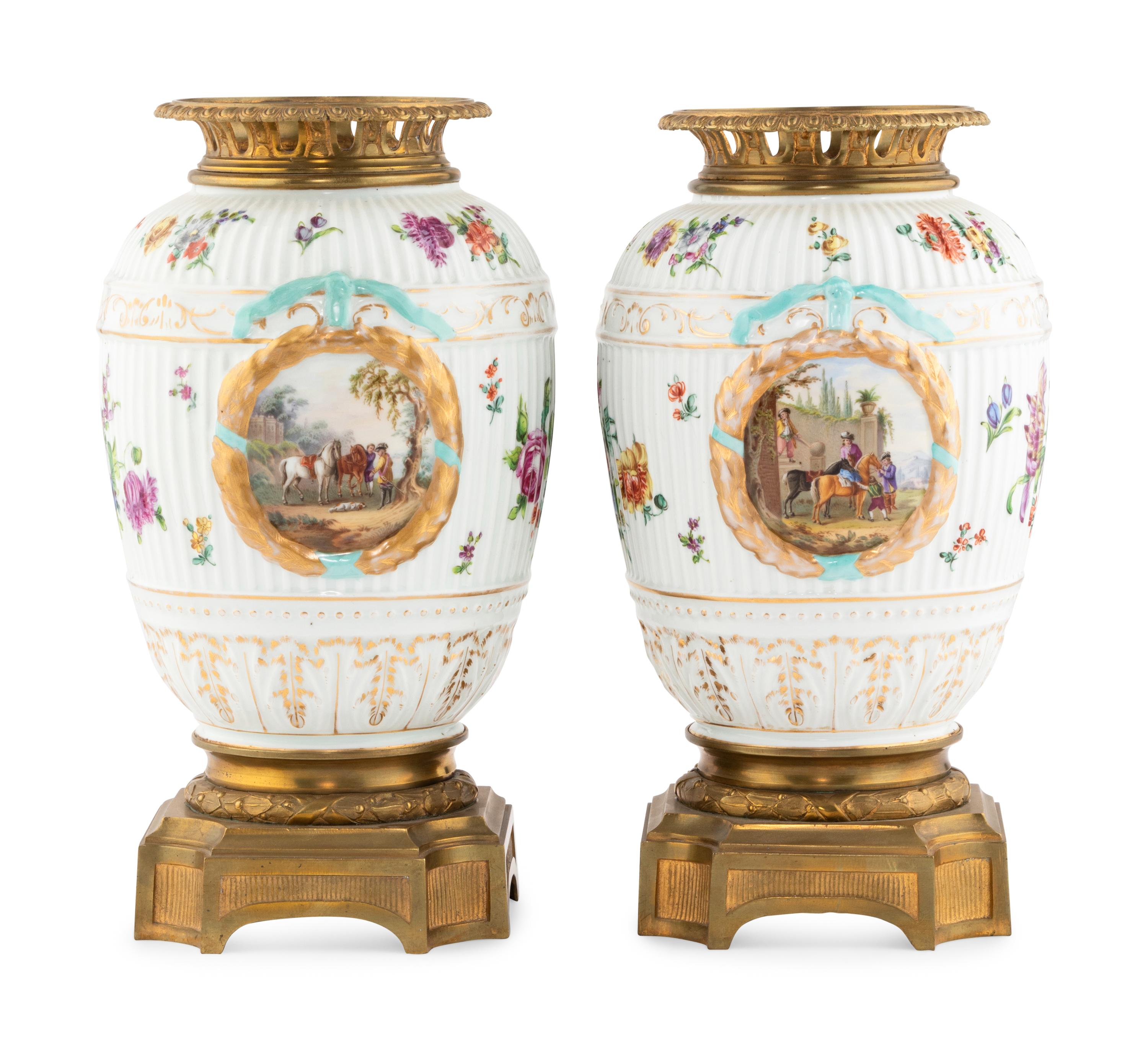 A Pair of German Gilt Bronze Mounted Porcelain Urns