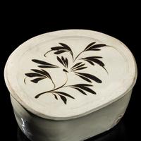 A Chinese Cizhou- Type White Glazed 'Floral' Porcelain Pillow, Yuan Dynasty 元 磁州窯白釉花卉紋枕