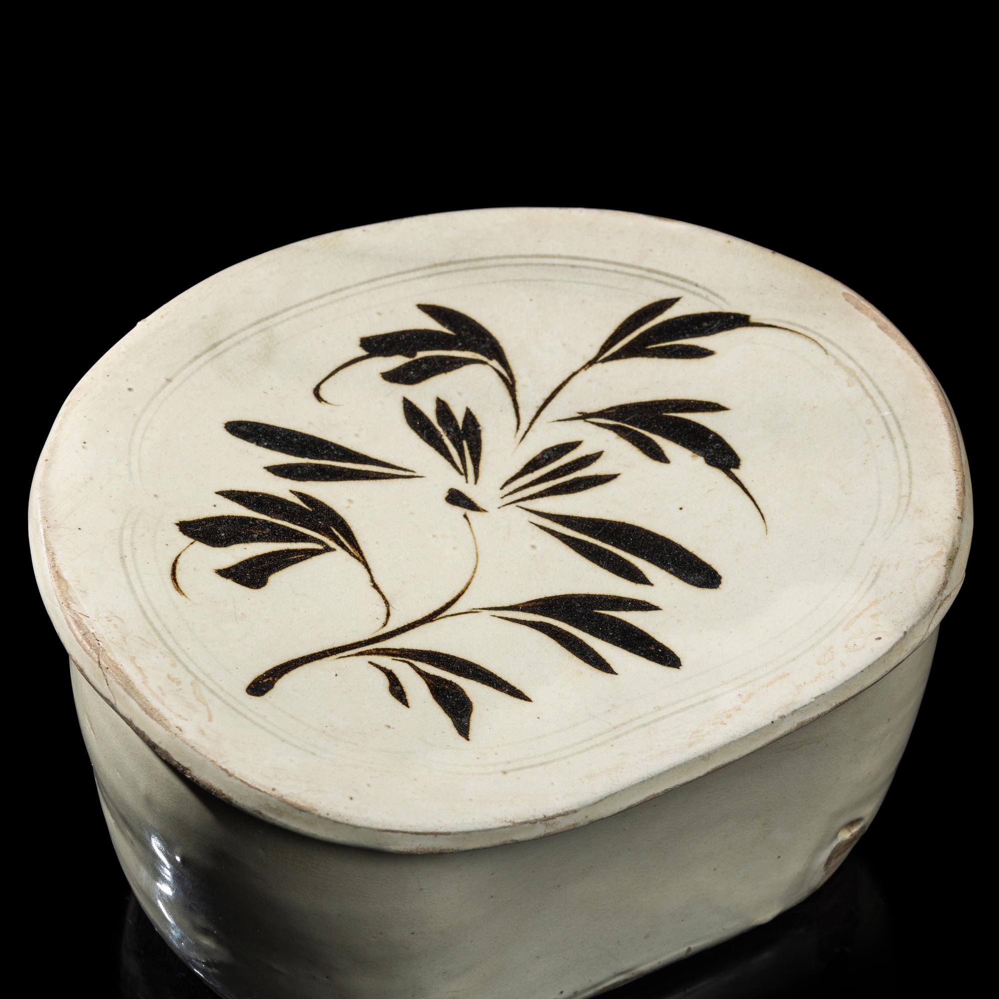 A Chinese Cizhou- Type White Glazed 'Floral' Porcelain Pillow, Yuan Dynasty 元 磁州窯白釉花卉紋枕