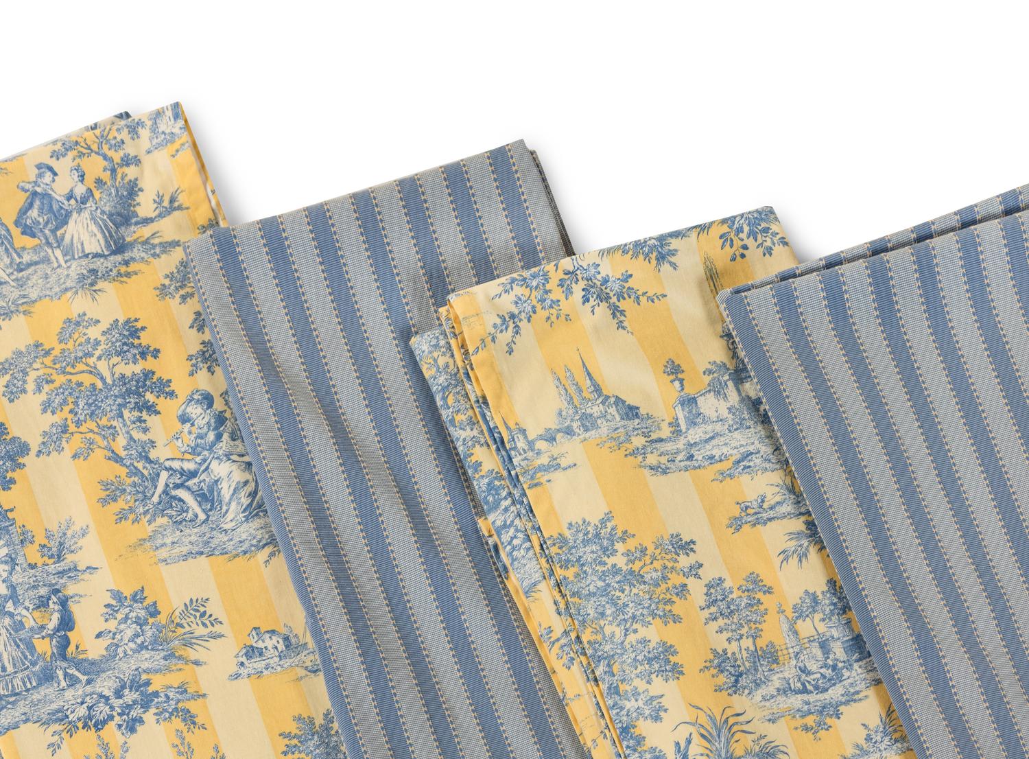 A Group of Blue and Yellow Table Linens