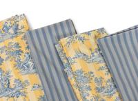 A Group of Blue and Yellow Table Linens