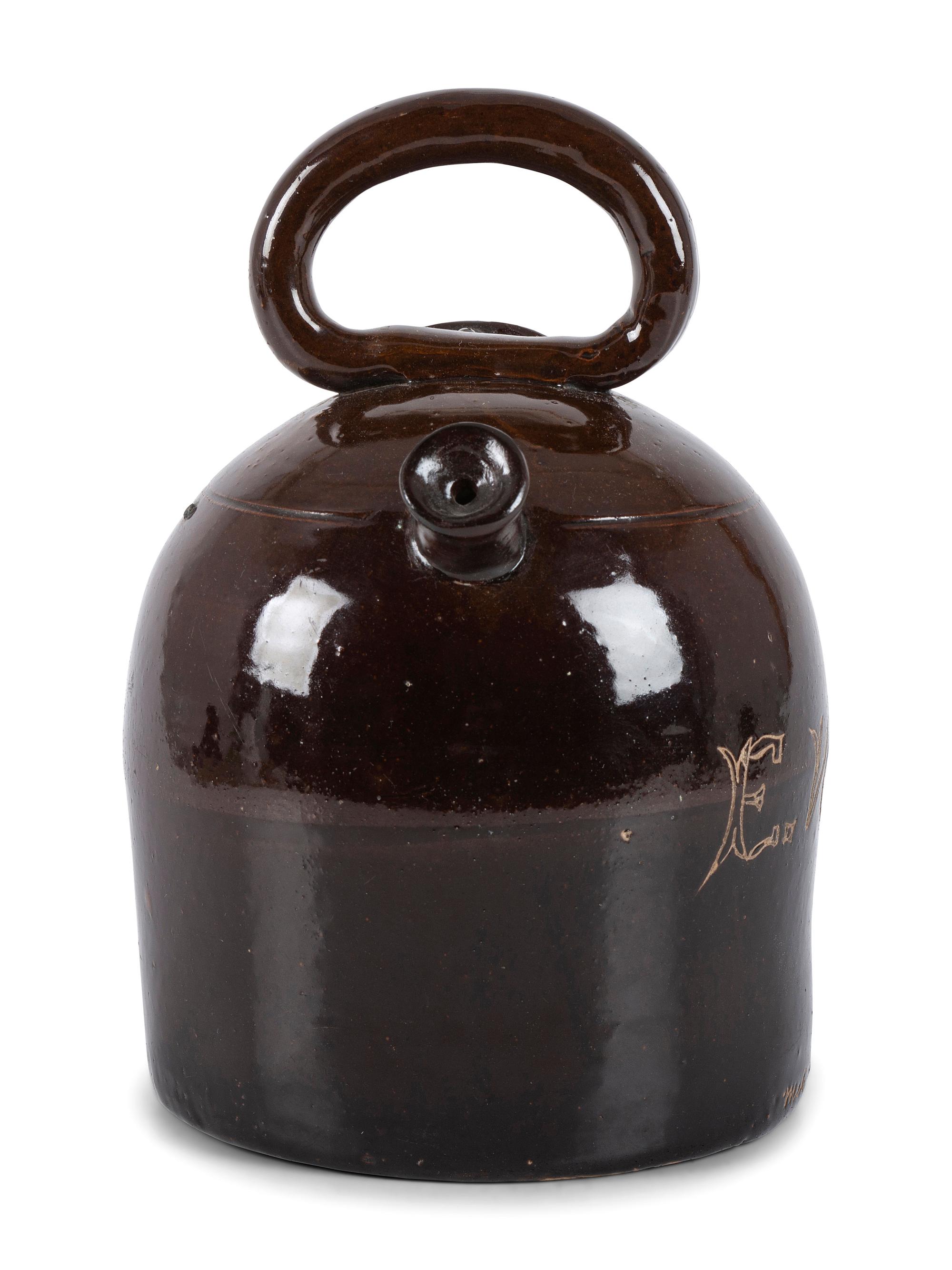 An Ohio Stoneware Albany Slip Harvest Jug