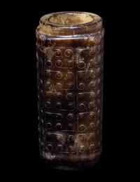 A Small Chinese Dark Russet and Celadon Jade Cong