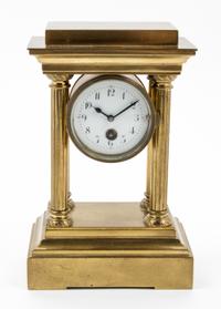 An Empire Style Brass Mantel Clock Height 7 inches.