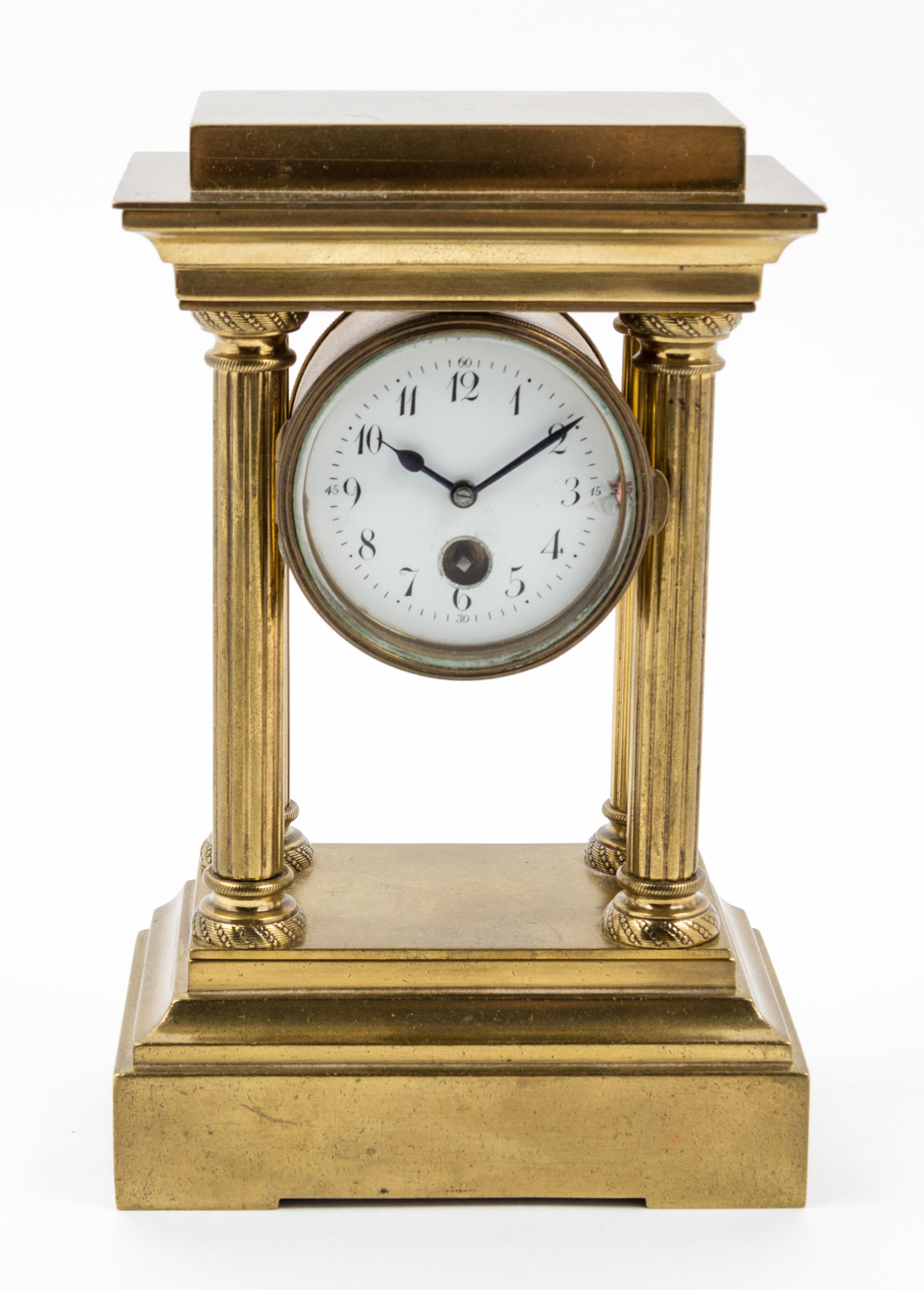 An Empire Style Brass Mantel Clock Height 7 inches.