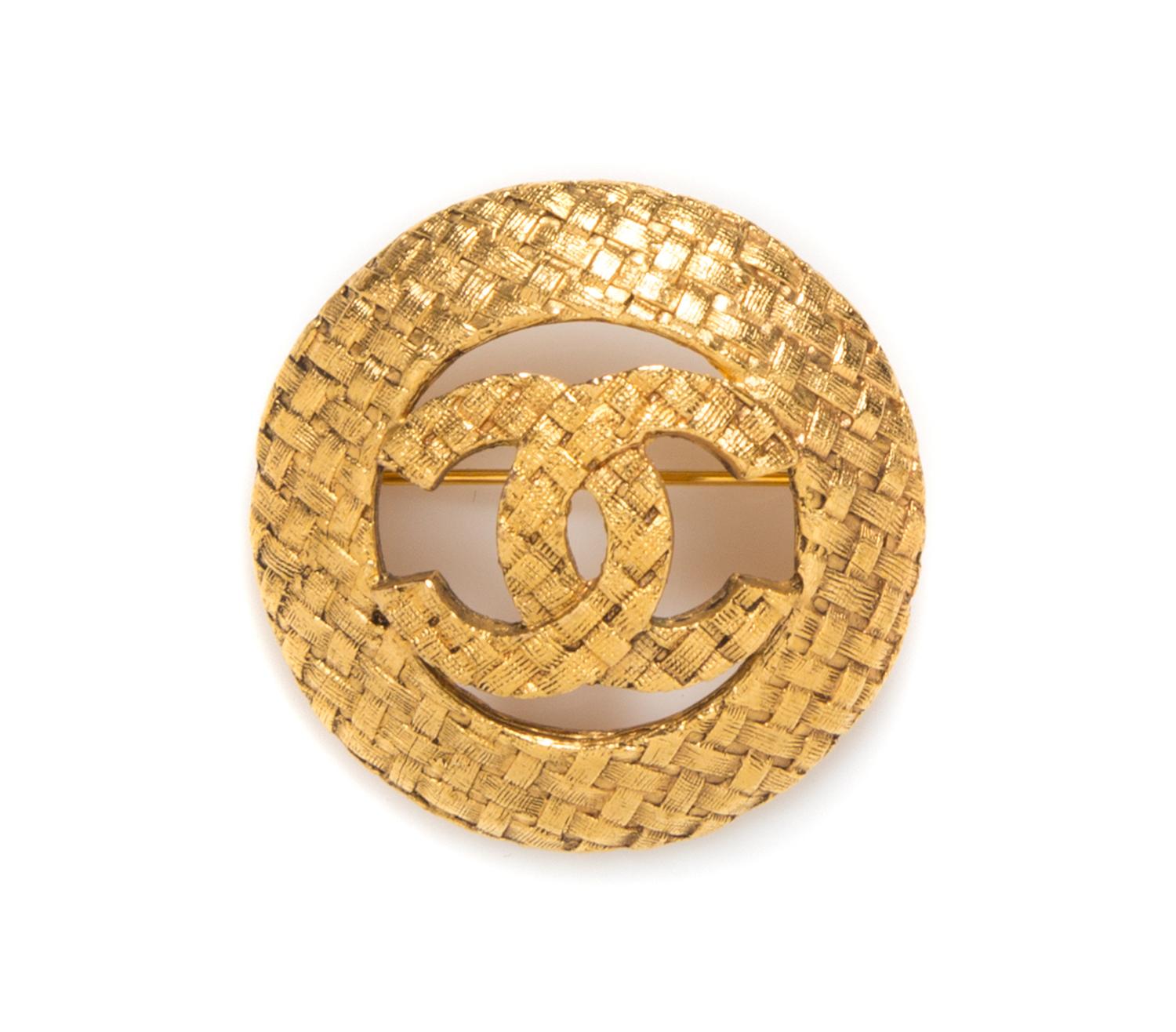 A Chanel Circular Logo Brooch,