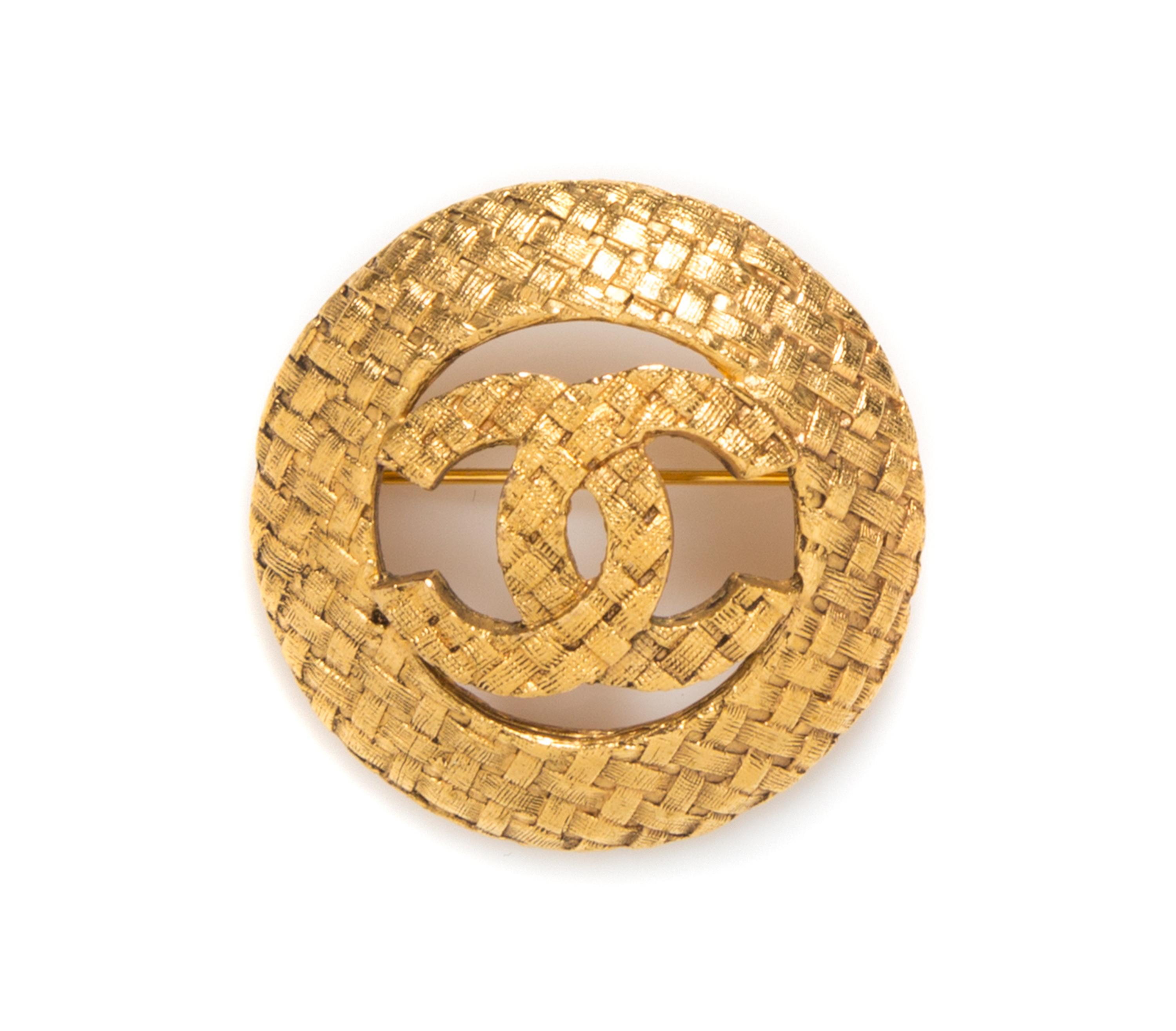 A Chanel Circular Logo Brooch,