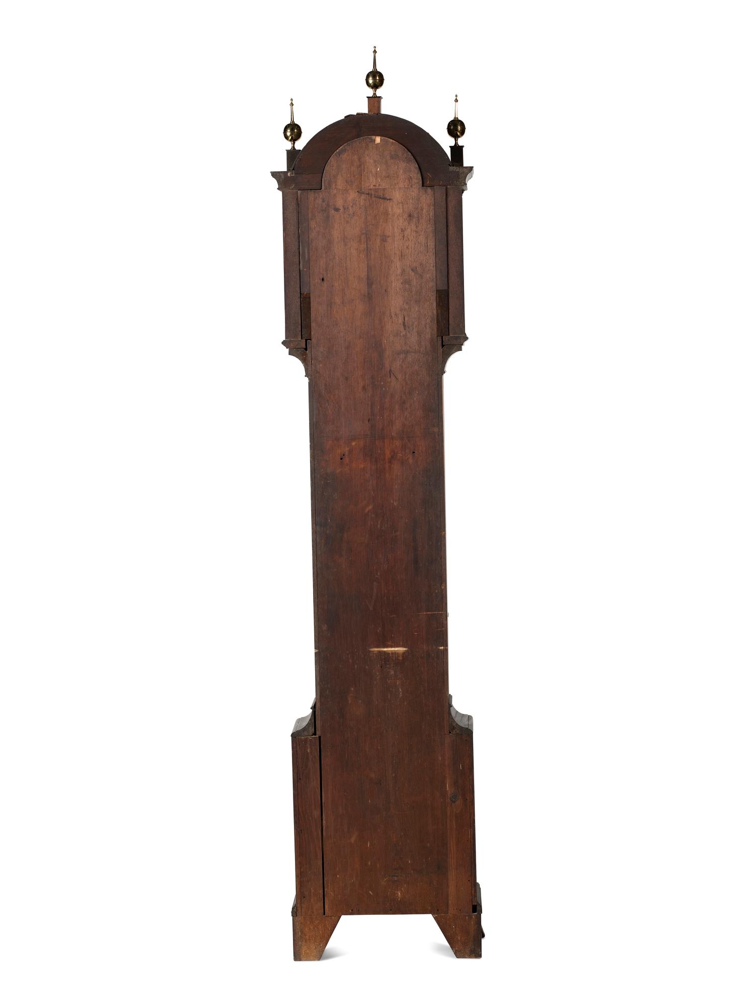 A Federal Carved and Inlaid, Brass-Mounted Mahogany Tall Case Clock