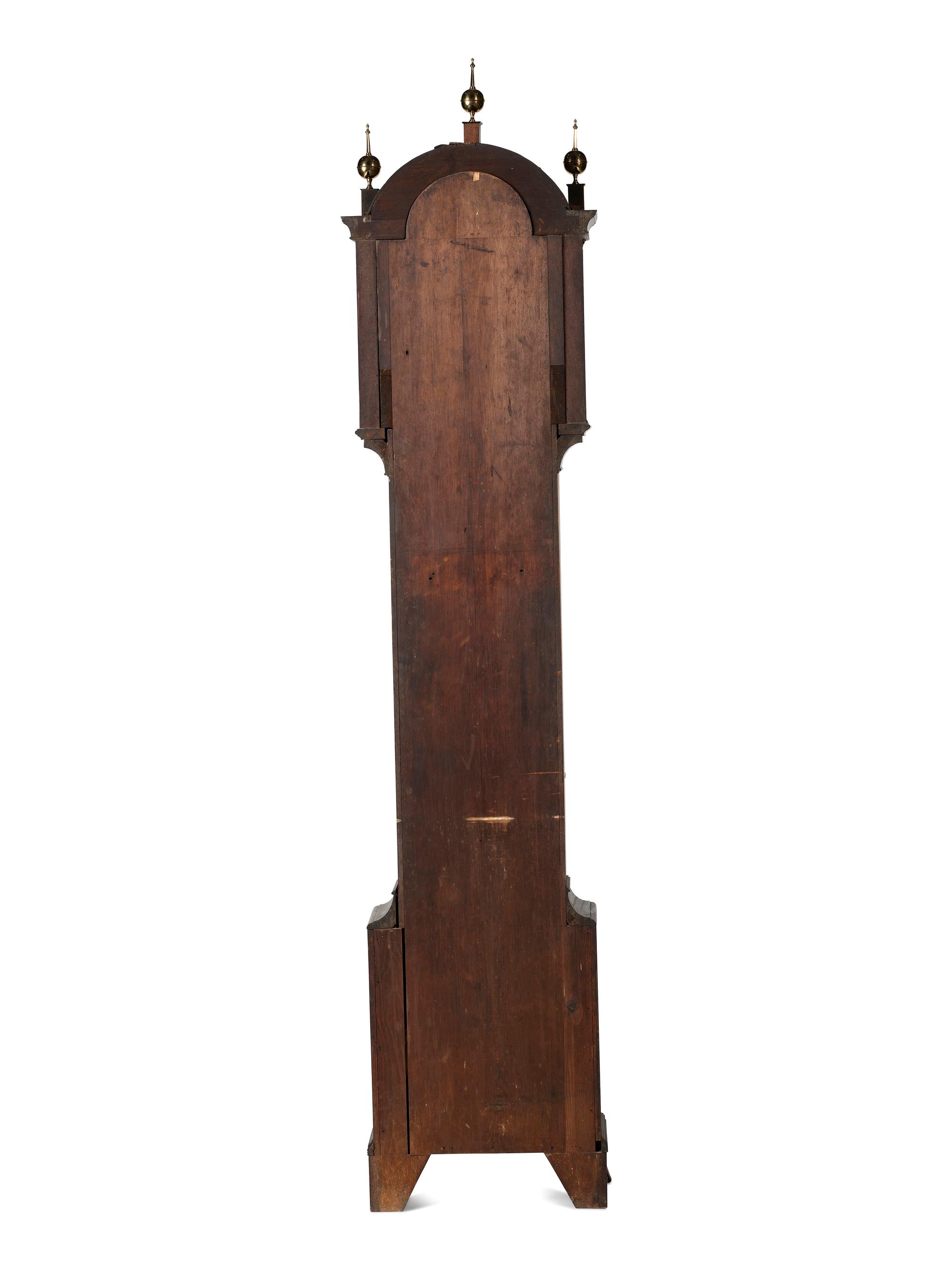 A Federal Carved and Inlaid, Brass-Mounted Mahogany Tall Case Clock