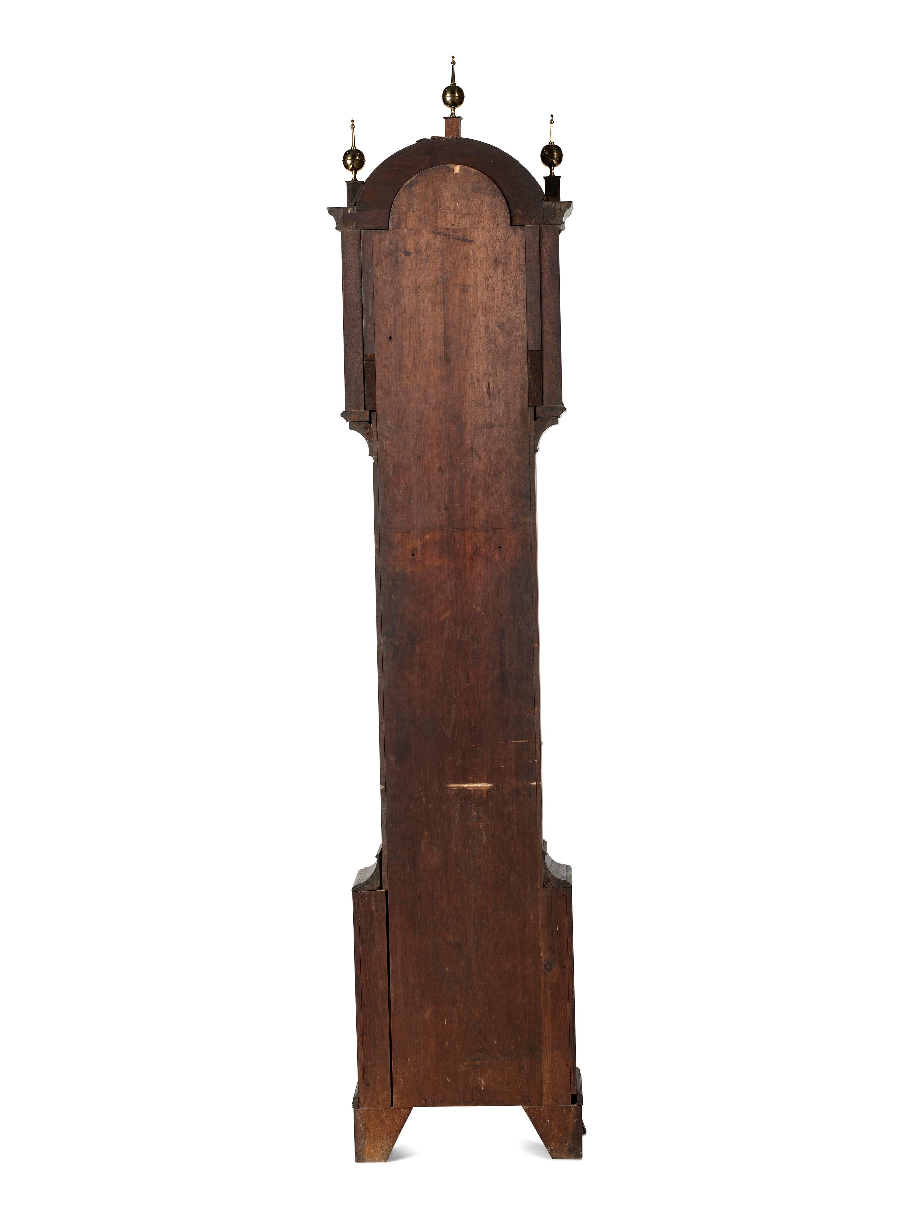 A Federal Carved and Inlaid, Brass-Mounted Mahogany Tall Case Clock